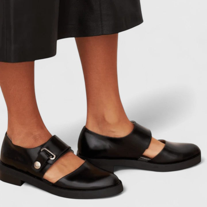 Black leather Mary Jane shoes with adjustable side buckle strap and low block heel