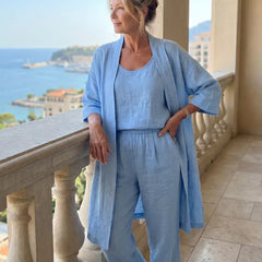 Light blue women's elegant set with draped cardigan and relaxed wide-leg pants