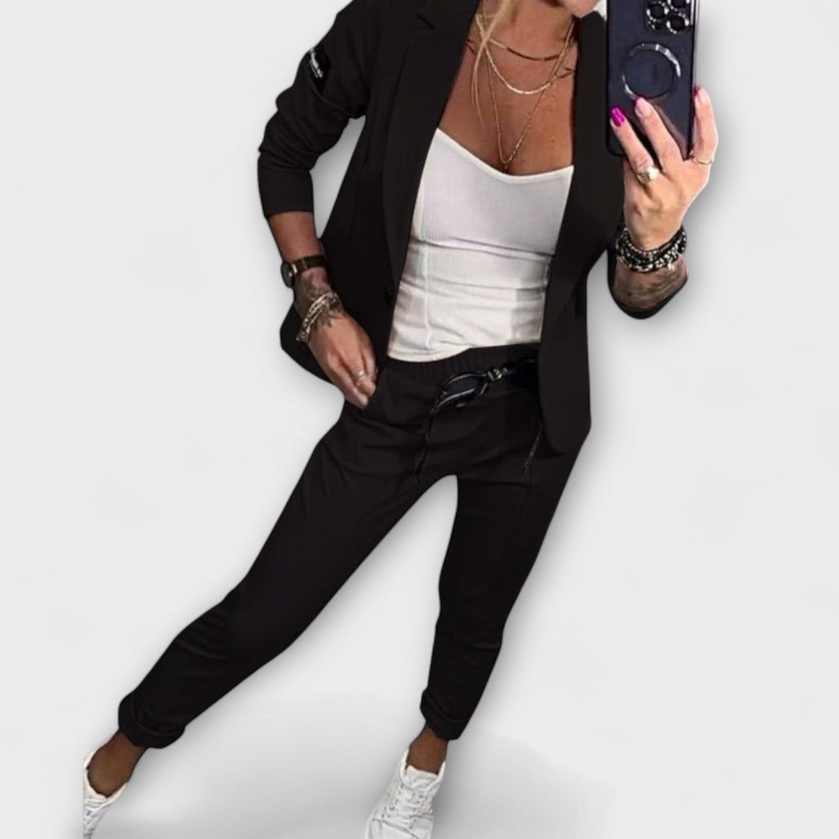 Black blazer and pants set with white camisole top, tailored fit, 3/4 sleeves.