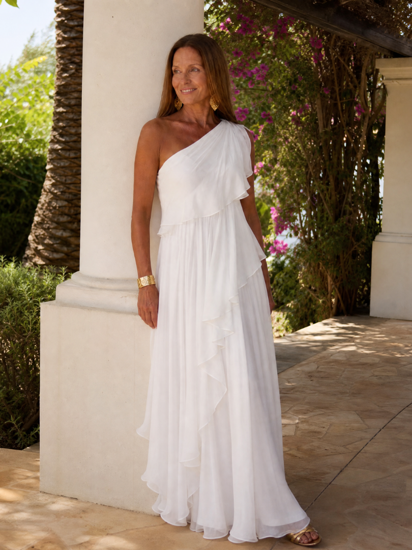 White one-shoulder maxi dress with asymmetrical ruffle detail and chiffon maxi length