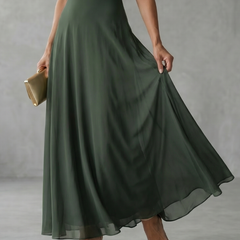 Off-shoulder draped midi dress in dark green, close-up of skirt drape and hem