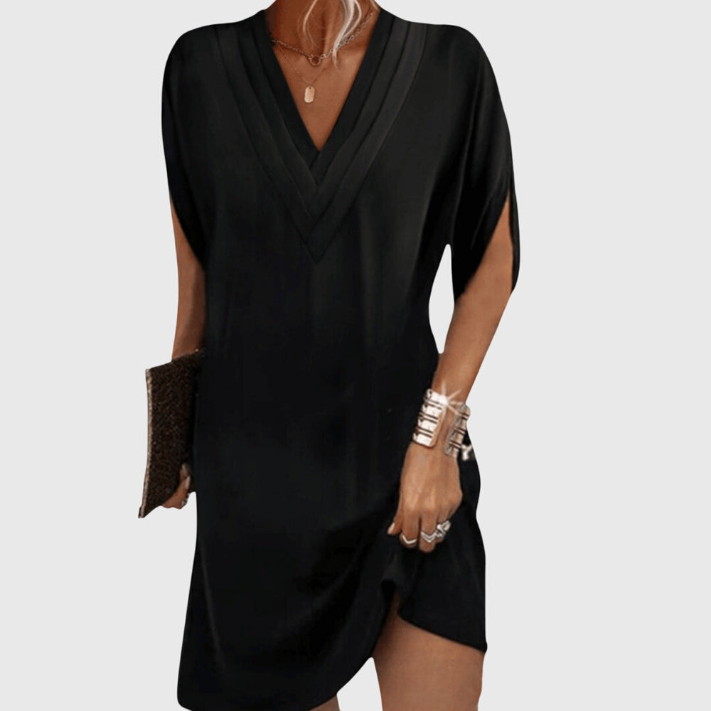 Black draped V-neck dress with short sleeves and wrap-like crossover front