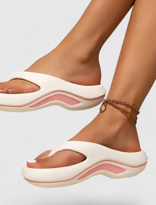 Comfort slide sandals in white with pink-toned wave sole detailing