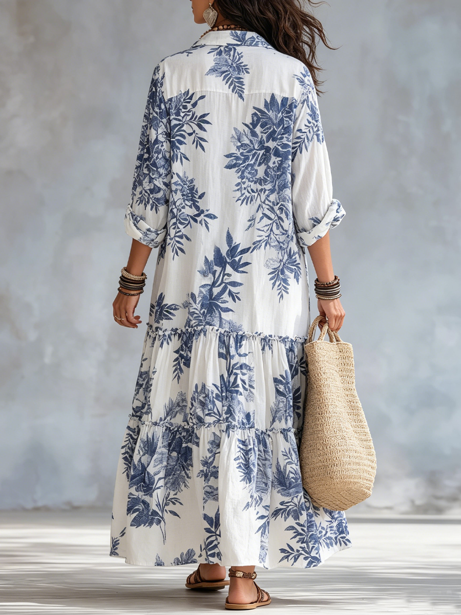 Back view of blue floral tiered maxi dress, button-front placket, 3/4 sleeves