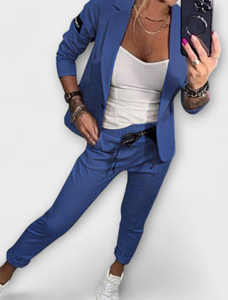 Blue blazer and pants set with white camisole top, tailored fit, 3/4 sleeves.