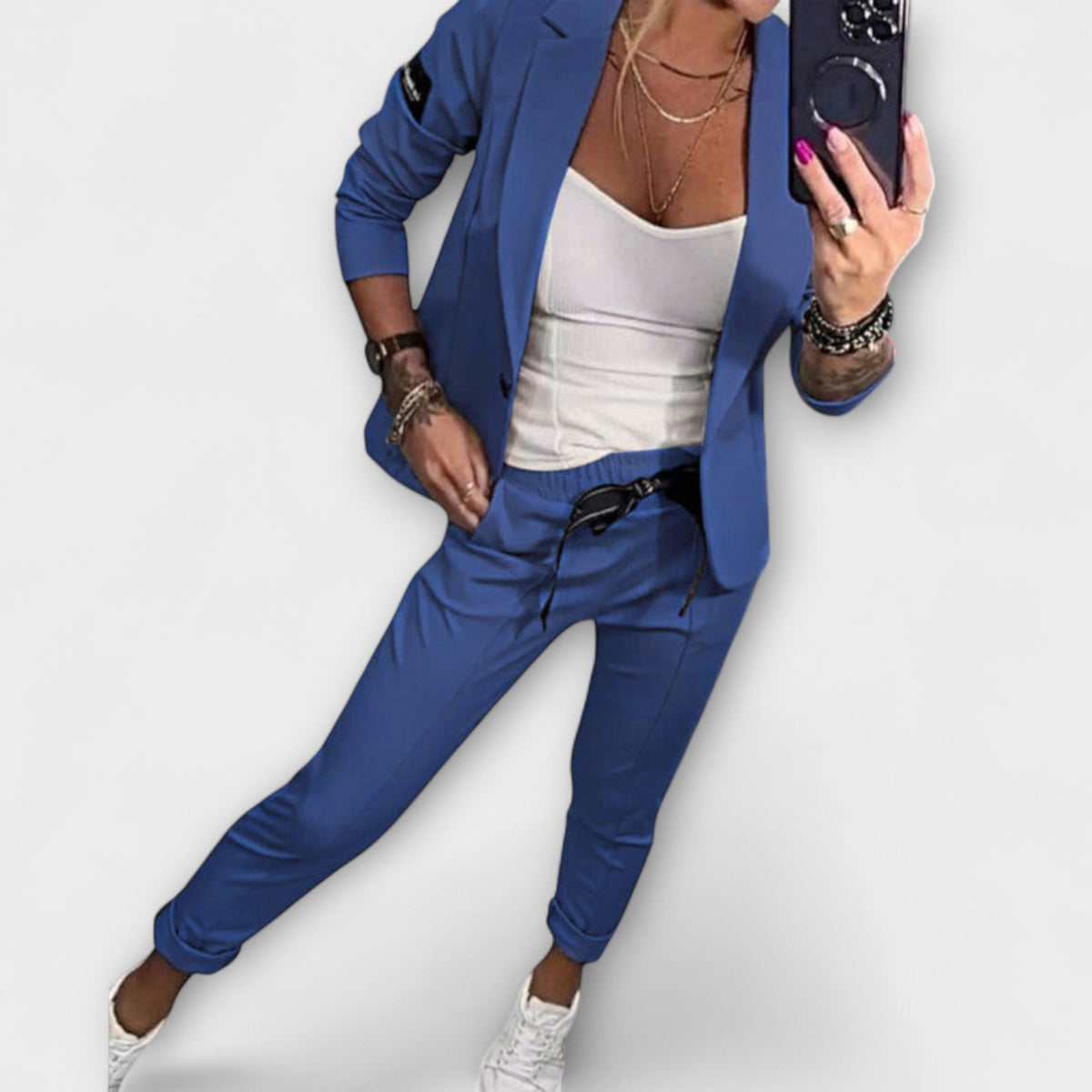 Blue blazer and pants set with white camisole top, tailored fit, 3/4 sleeves.