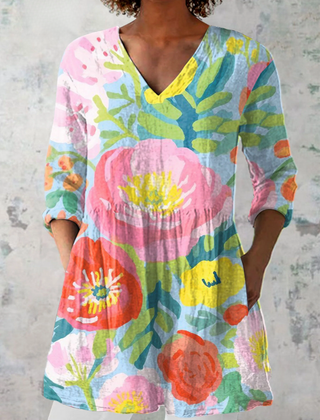 Multicolor long V-neck blouse with loose fit and colorful floral print, three-quarter sleeves