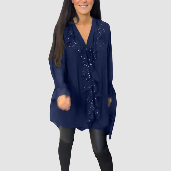 Dark blue ruffled blouse with V-neck and embellished front, flowy long sleeves.