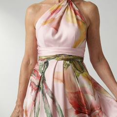 Floral halter maxi dress close-up; pale pink satin with multicolor leaf and flower print