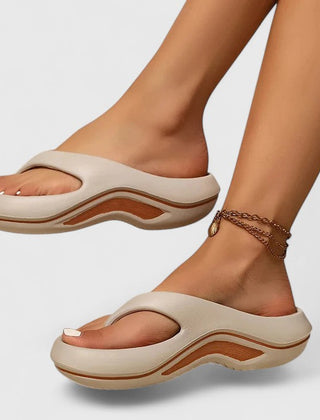Comfort slide sandals in light beige with brown wave sole detailing