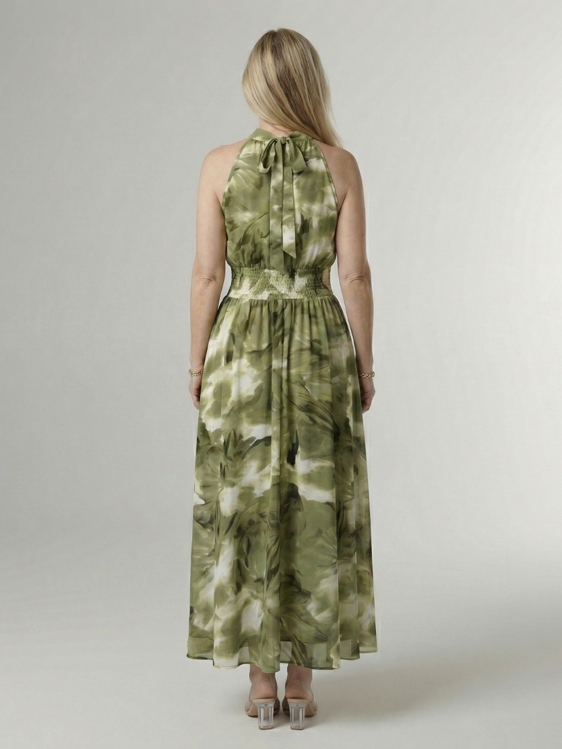 Green gathered halter midi dress with sleeveless back detail and tiered skirt.