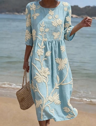 Blue casual dress with cream floral print, gathered waist, 3/4 sleeves, round neck