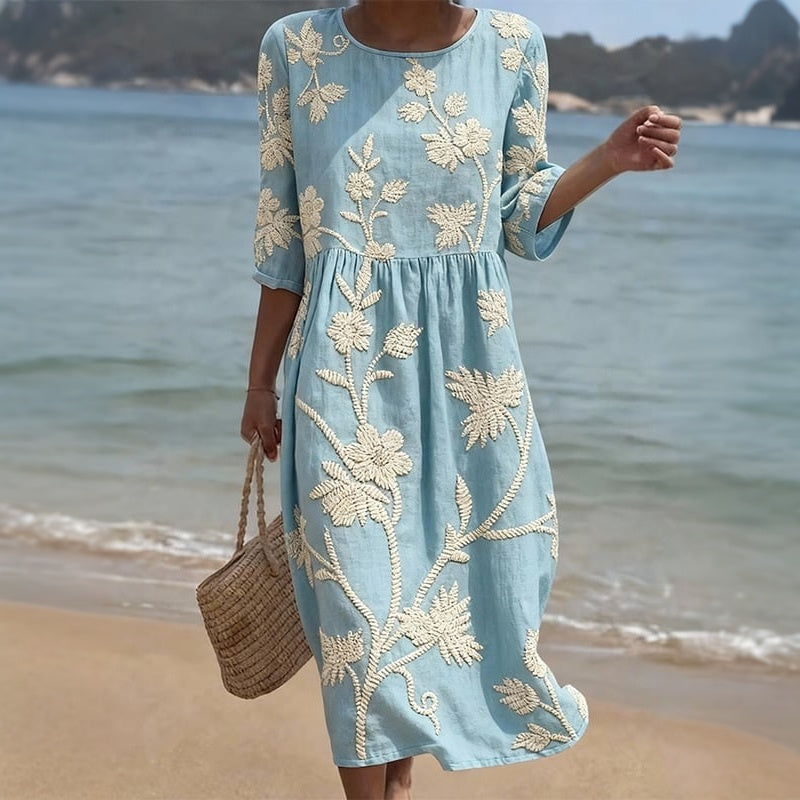 Blue casual dress with cream floral print, gathered waist, 3/4 sleeves, round neck