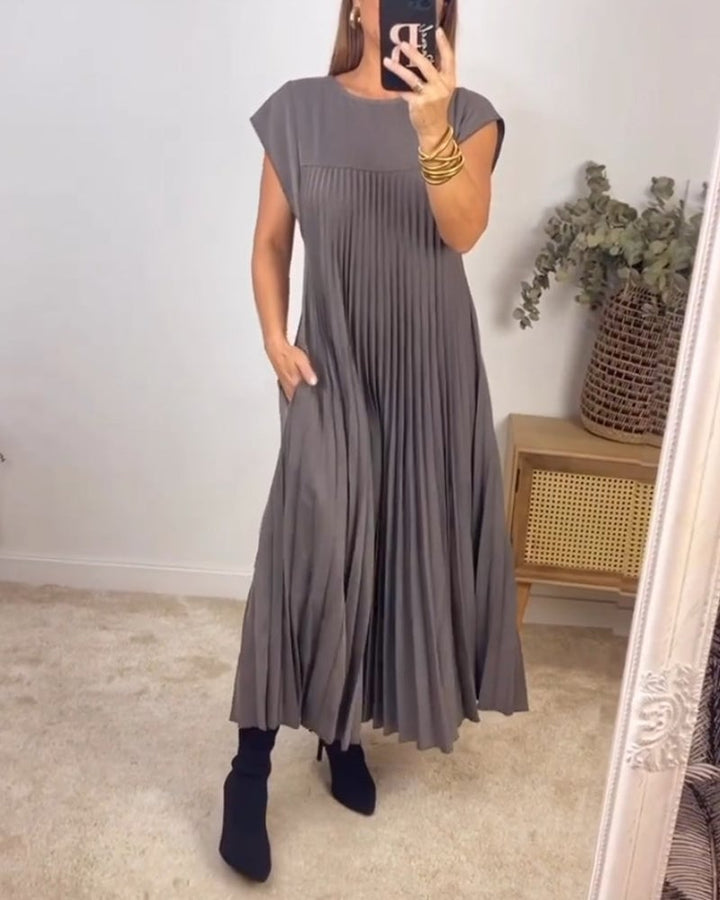 Pleated maxi dress in dark gray with cap sleeves and vertical pleat detailing