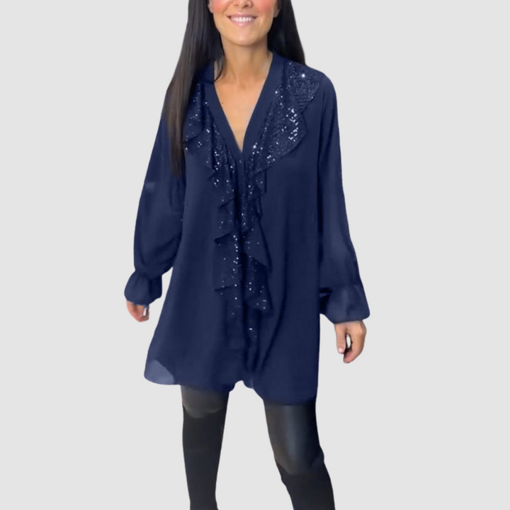 Dark blue ruffled blouse with V-neck and sparkling front detail, long loose sleeves.