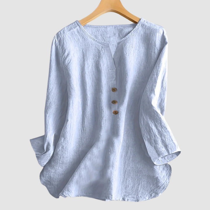 Light blue linen-cotton blouse with V-neck and three-button front, 3/4 sleeves