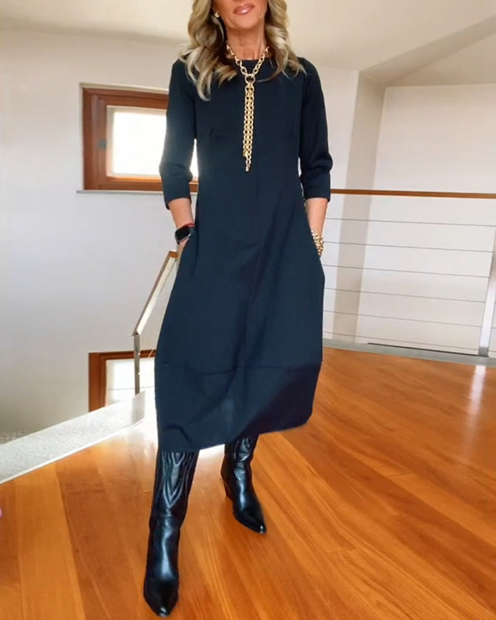 Nia casual elegance dress, dark color, 3/4 sleeves, relaxed midi length, round neckline