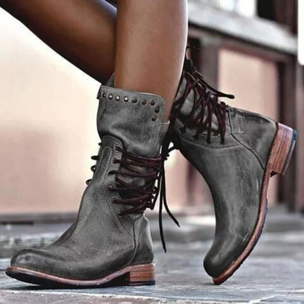Vintage lace-up boots in gray leather with studded cuff and dark laces