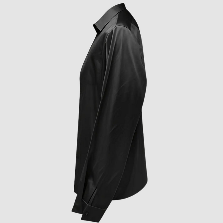 Black satin blouse side view with pointed collar and long sleeves, button cuff.