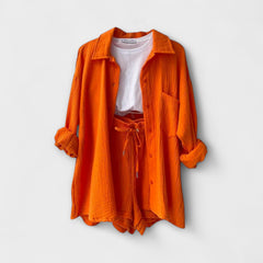 Orange two-piece set, button-front shirt over drawstring-waist shorts