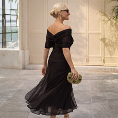 Off-shoulder maxi dress in black with ruched off-shoulder neckline and tulle skirt