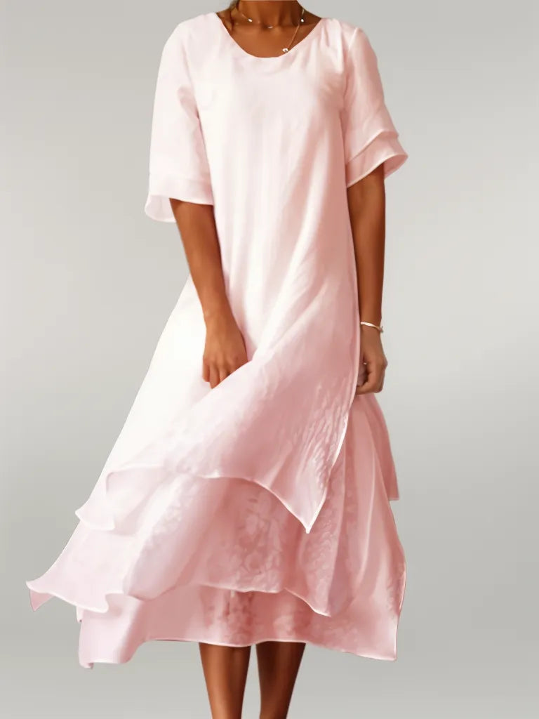 Pink cotton long dress with short sleeves, round neck, and layered ruffle hem