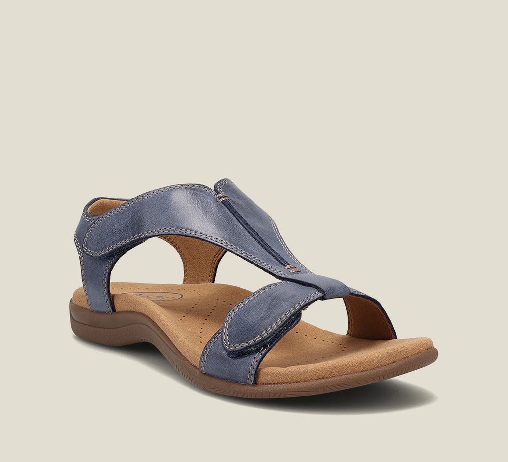 Blue orthopedic vegan leather sandal with open toe, wide strap, and cushioned sole.