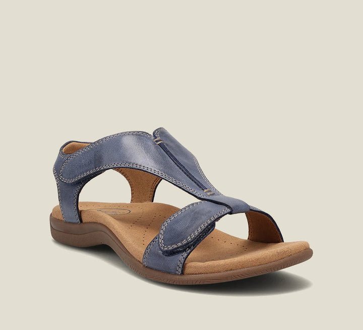 Blue orthopedic vegan leather sandal with open toe, wide strap, and cushioned sole.