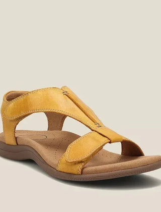 Yellow orthopedic sandals with wide cross-strap and low cushioned sole