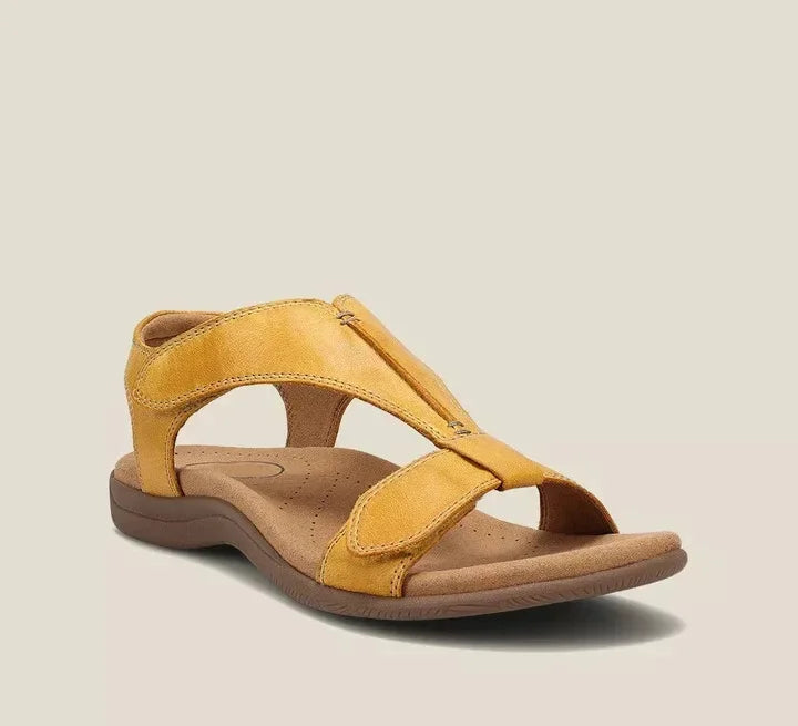 Yellow orthopedic sandals with wide cross-strap and low cushioned sole