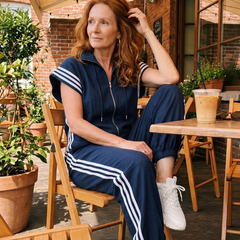 Lark stripe jumpsuit in brown with front zipper and white side stripe detail