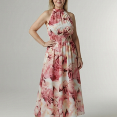 Pink floral gathered halter midi dress with ruched neckline and full flowing skirt.