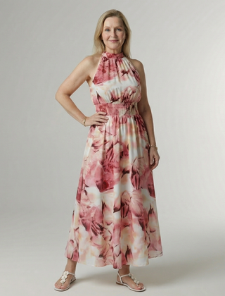 Pink floral gathered halter midi dress with ruched neckline and full flowing skirt.