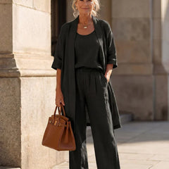 Black women's elegant set: draped short-sleeve cardigan over matching wide-leg pants