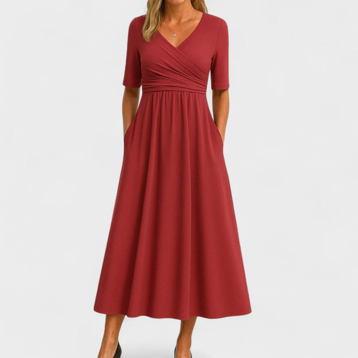 Red wrap-style midi dress with V-neck, short sleeves, and gathered full skirt