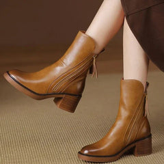 Brown leather ankle boots with side zipper and tassel pull, block heel.