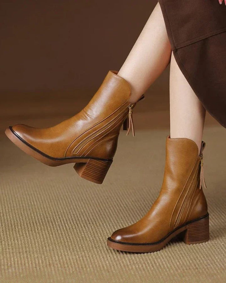 Brown leather ankle boots with side zipper and tassel pull, block heel.