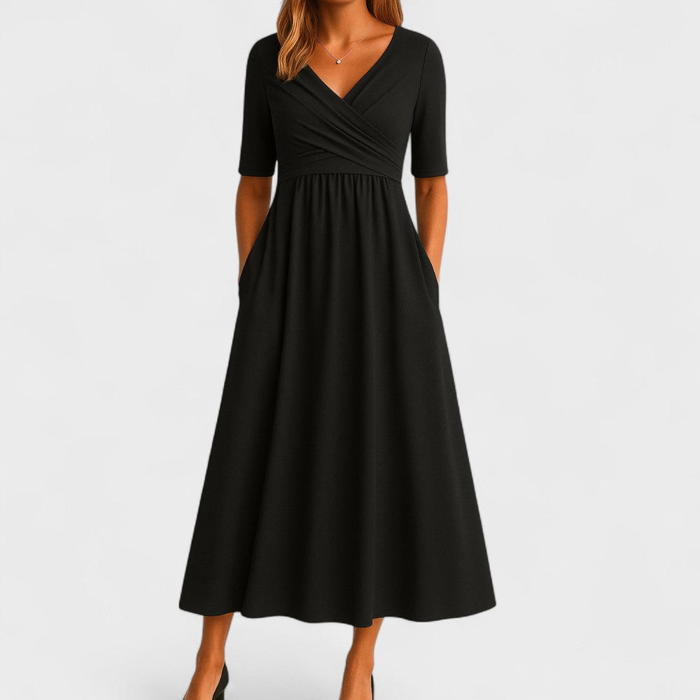 Black wrap-style midi dress with V-neck, short sleeves, and gathered skirt