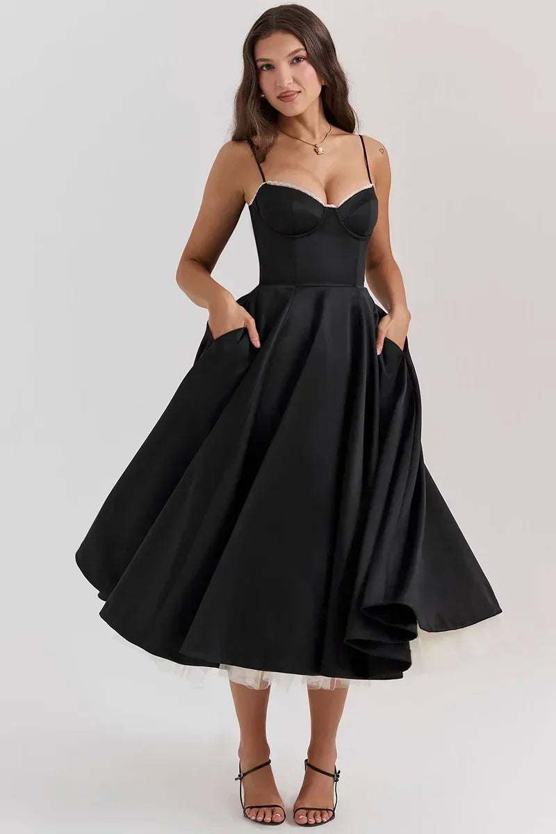 Black flared mini dress with thin straps, structured bust, and full skirt