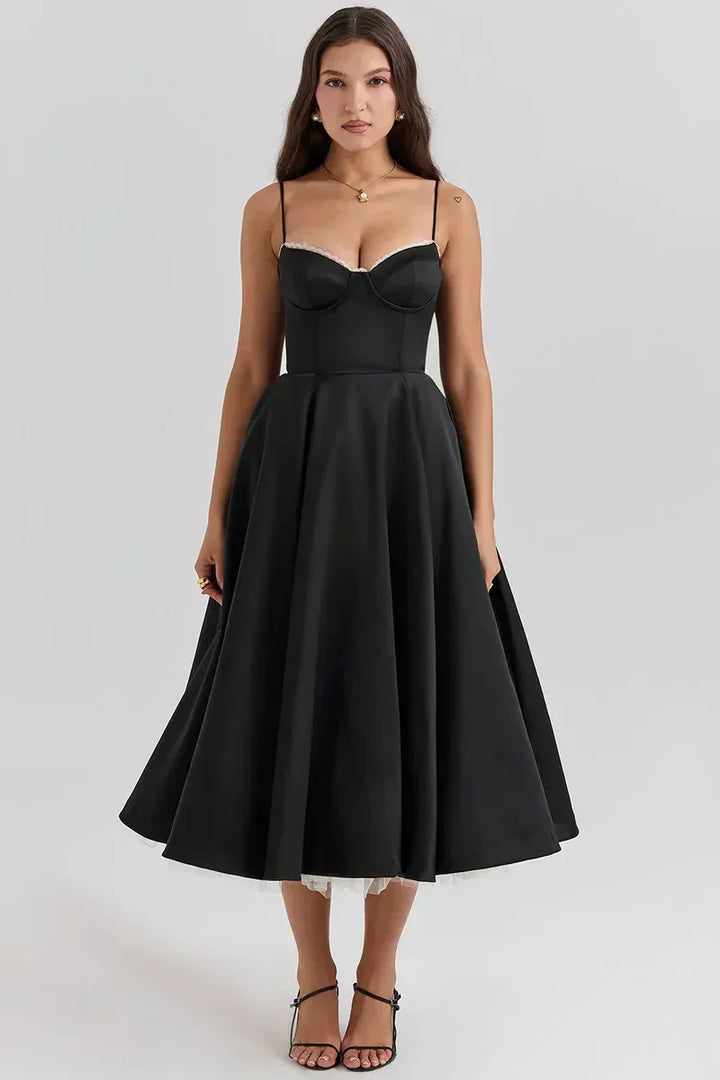 Black sweetheart dress with thin straps and pleated, full circle skirt