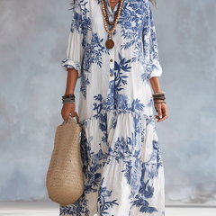 Bohemian tiered maxi dress in white with blue floral print, button-front, 3/4 sleeves