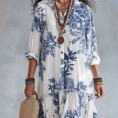 Blue floral button-front tiered maxi dress with 3/4 sleeves on white ground