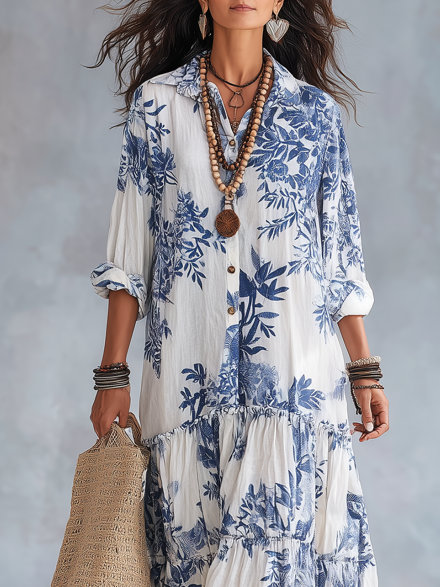Blue floral button-front tiered maxi dress with 3/4 sleeves on white ground