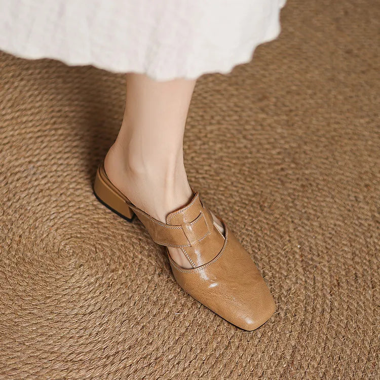 Apricot leather mule with crossover strap and pointed toe, showing low block heel