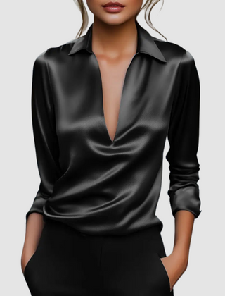 Black satin blouse with pointed collar, deep V-neck, long sleeves, button cuffs.