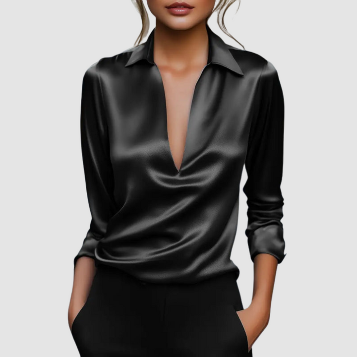 Black satin blouse with pointed collar, deep V-neck, long sleeves, button cuffs.