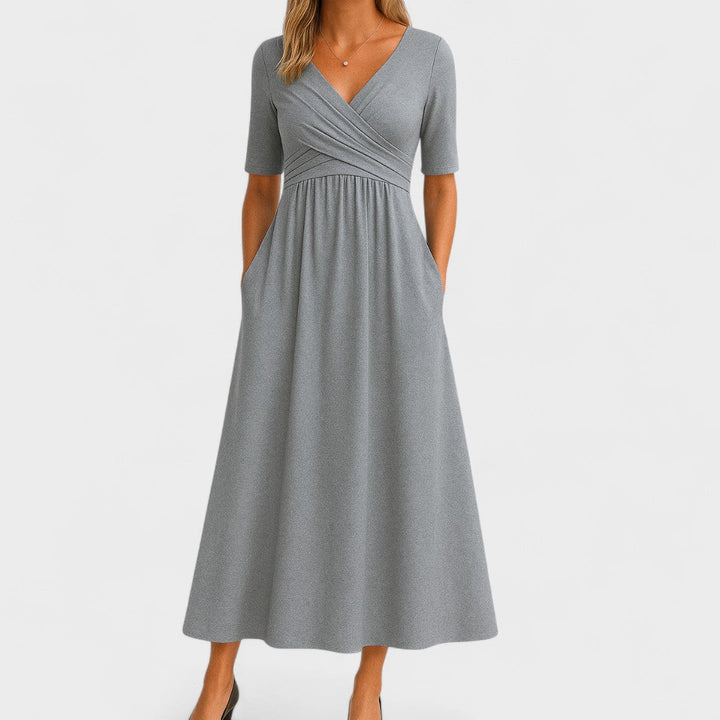 Gray wrap-style midi dress with V-neck, short sleeves, and gathered waist