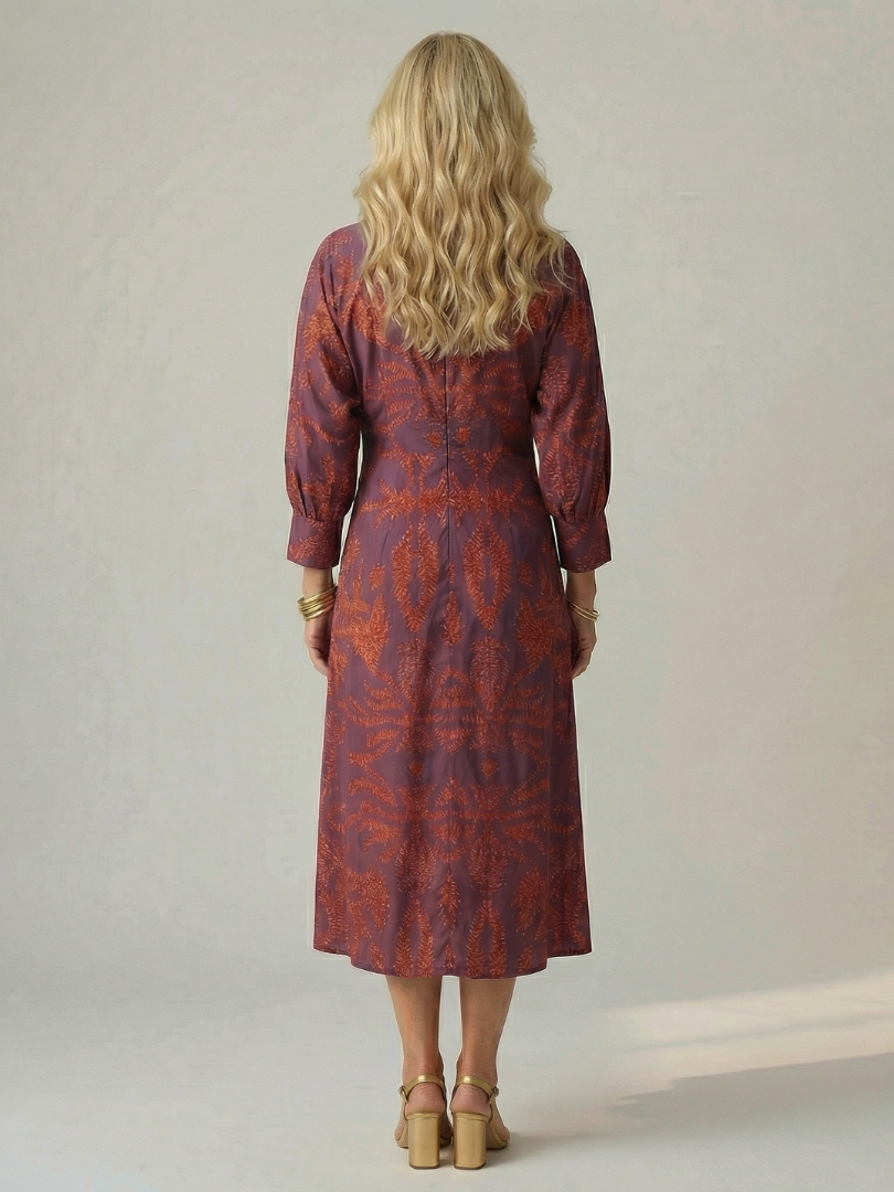 Back view wrap midi dress with three-quarter sleeves in purple and rust print