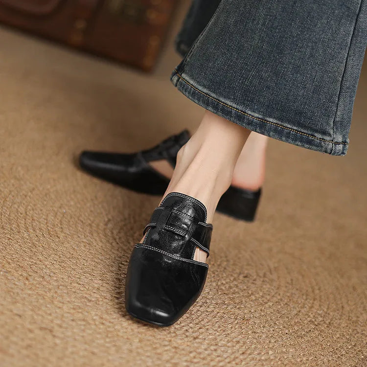 Black leather mules with square toe strap and adjustable buckle, low block heel