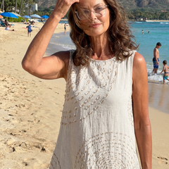 White textured midi dress, sleeveless with round neckline and gathered waist
